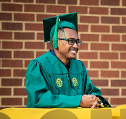 A student smiling. Links to Gifts by Will