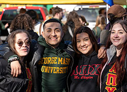 Four students smiling. Link to Life Stage Gift Planner Ages 45-65 Situations.