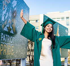 A graduate student smiling. Links to Gifts That Protect Your Assets